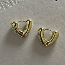 Load image into Gallery viewer, Skhek Simple Design Silver Color Hollow Heart Hoop Earrings For Women New Brand Fashion Ear Cuff Piercing Vintage Earring Gift